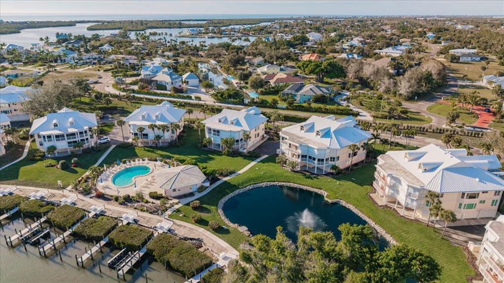 11000 Placida Road, Unit 1501 Placida, FL 33946 - Photo 3 of 46 an aerial view of residential houses with outdoor space