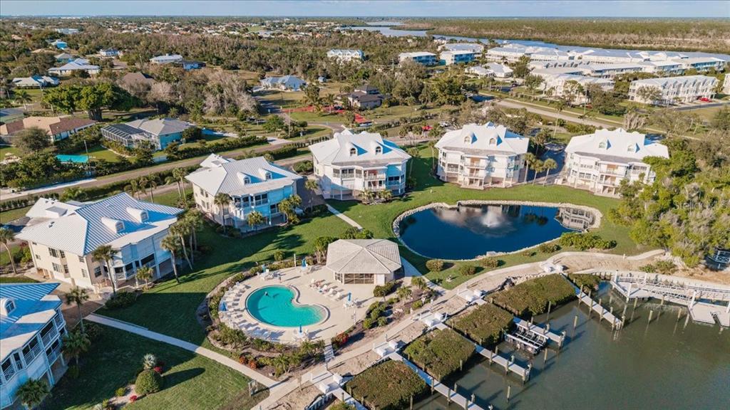 11000 Placida Road, Unit 1501 Placida, FL 33946 - Photo 42 of 46 an aerial view of residential houses with outdoor space