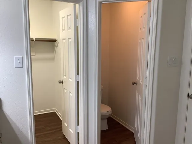 a view of a bathroom from a hallway