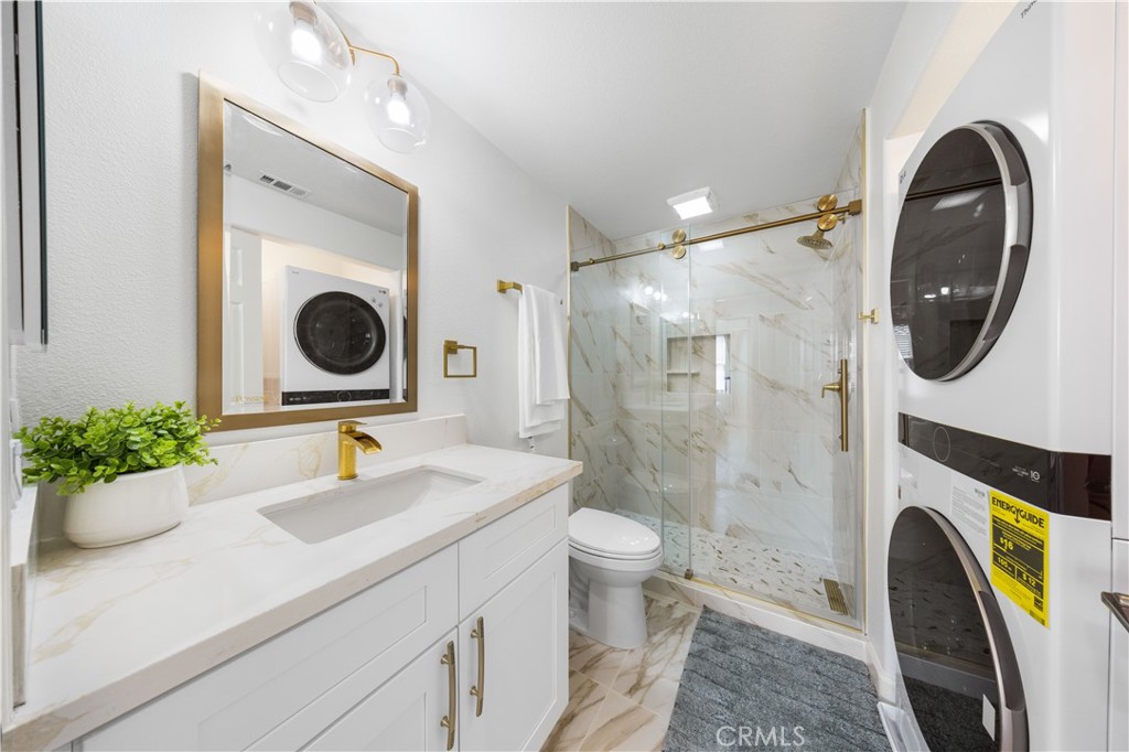 332 Quail Ridge Irvine, CA 92603 - Photo 12 of 25 a bathroom with a sink a toilet and a mirror