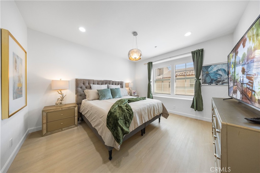 332 Quail Ridge Irvine, CA 92603 - Photo 13 of 25 a bed room with a bed and a couch