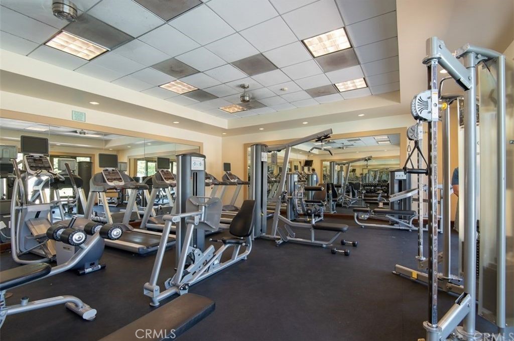 332 Quail Ridge Irvine, CA 92603 - Photo 19 of 25 a view of a room with gym equipment