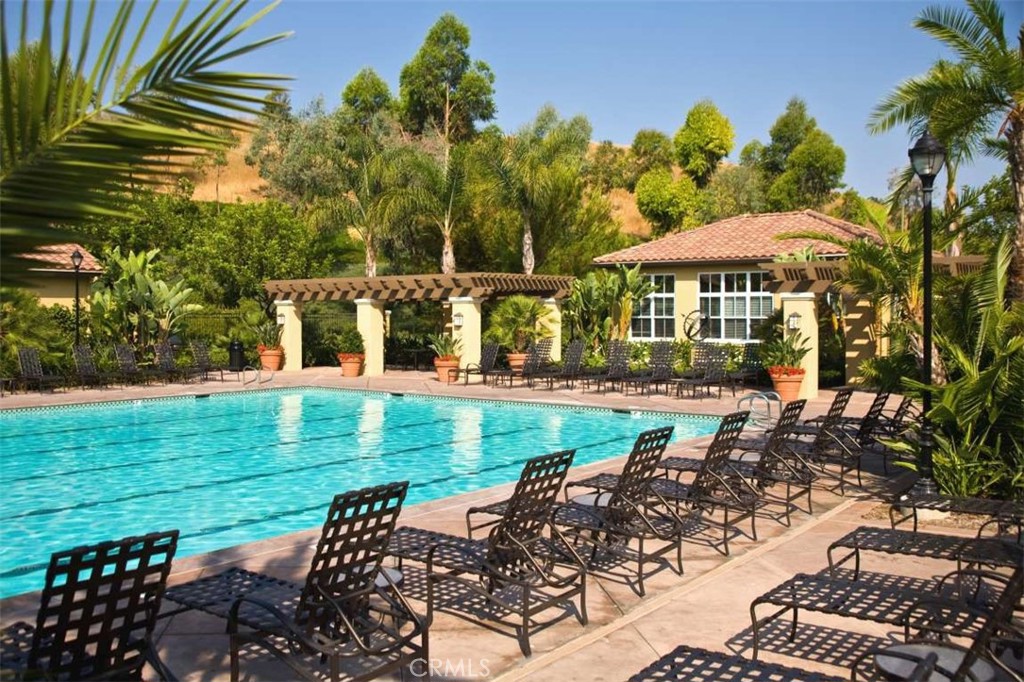 332 Quail Ridge Irvine, CA 92603 - Photo 20 of 25 a view of a patio with table and chairs and potted plants