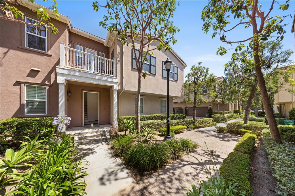 332 Quail Ridge Irvine, CA 92603 - Photo 2 of 25 a view of a garden with a tree