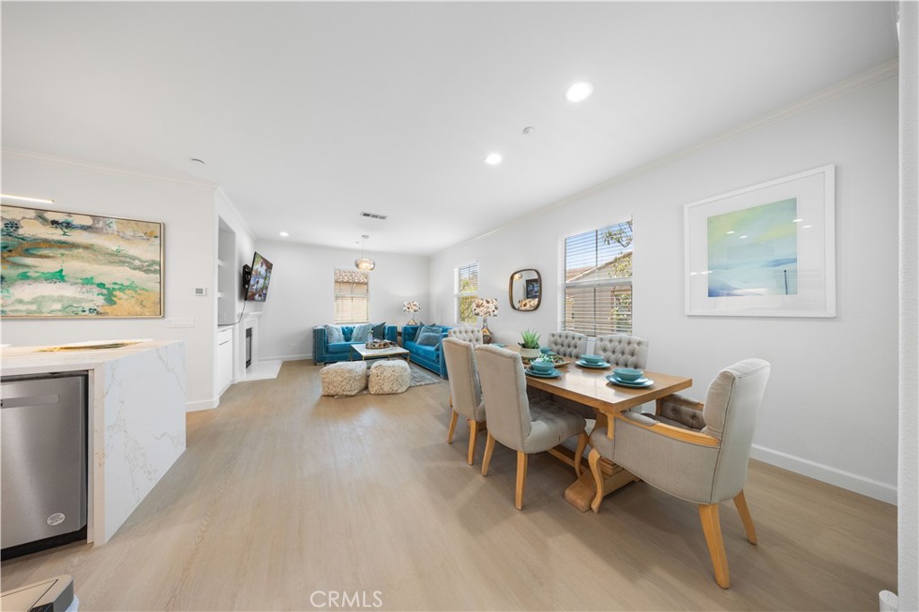 332 Quail Ridge Irvine, CA 92603 - Photo 5 of 25 a living room with furniture and a wooden floor