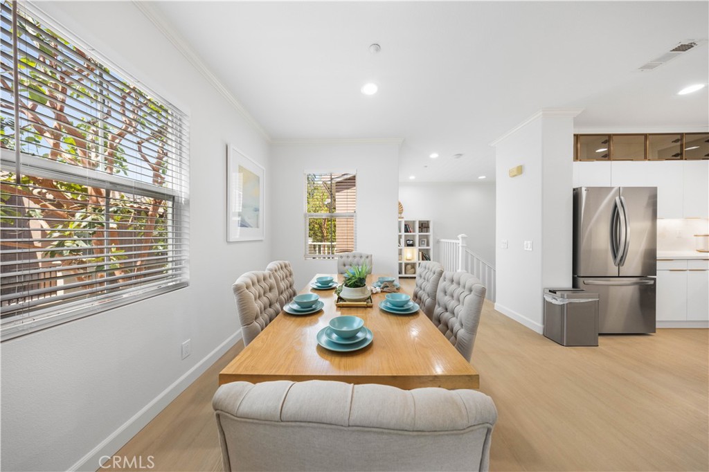332 Quail Ridge Irvine, CA 92603 - Photo 7 of 25 a dining room with furniture and a window