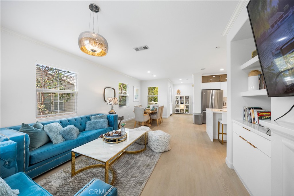 332 Quail Ridge Irvine, CA 92603 - Photo 9 of 25 a living room with furniture a rug and a window