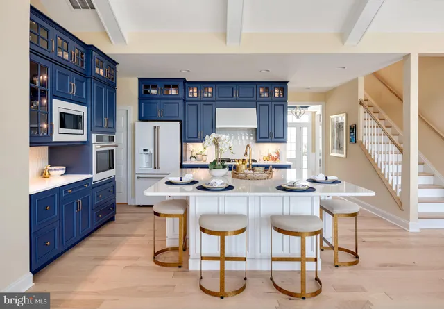 a kitchen with a sink cabinets and window