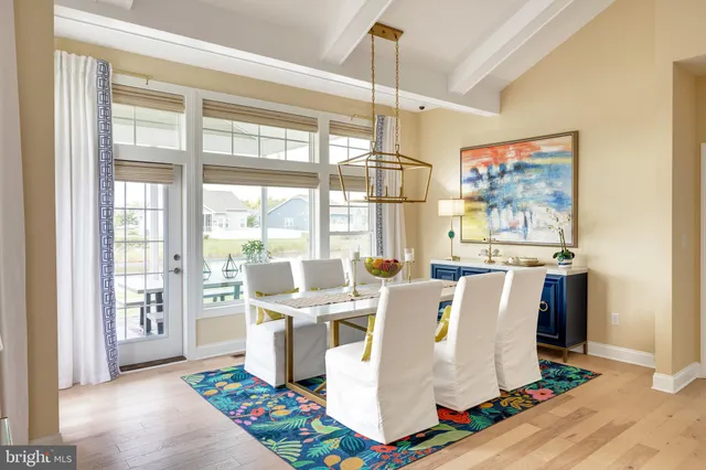 a living room with kitchen island furniture and a window