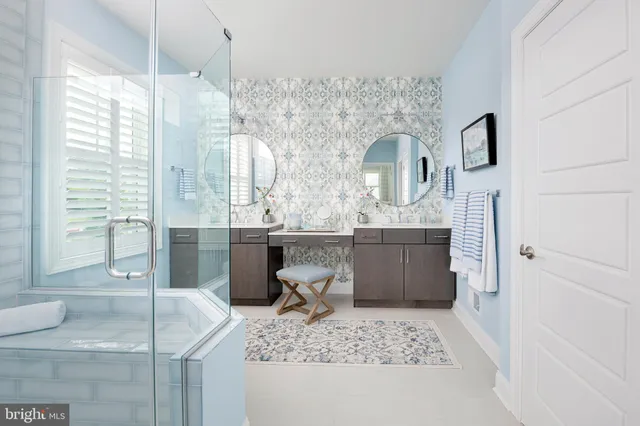 a bathroom with a tub sink and mirror