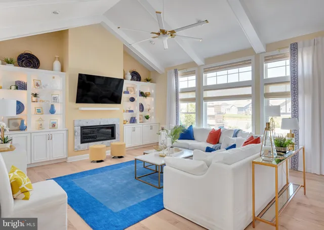 a living room with fireplace furniture and a flat screen tv