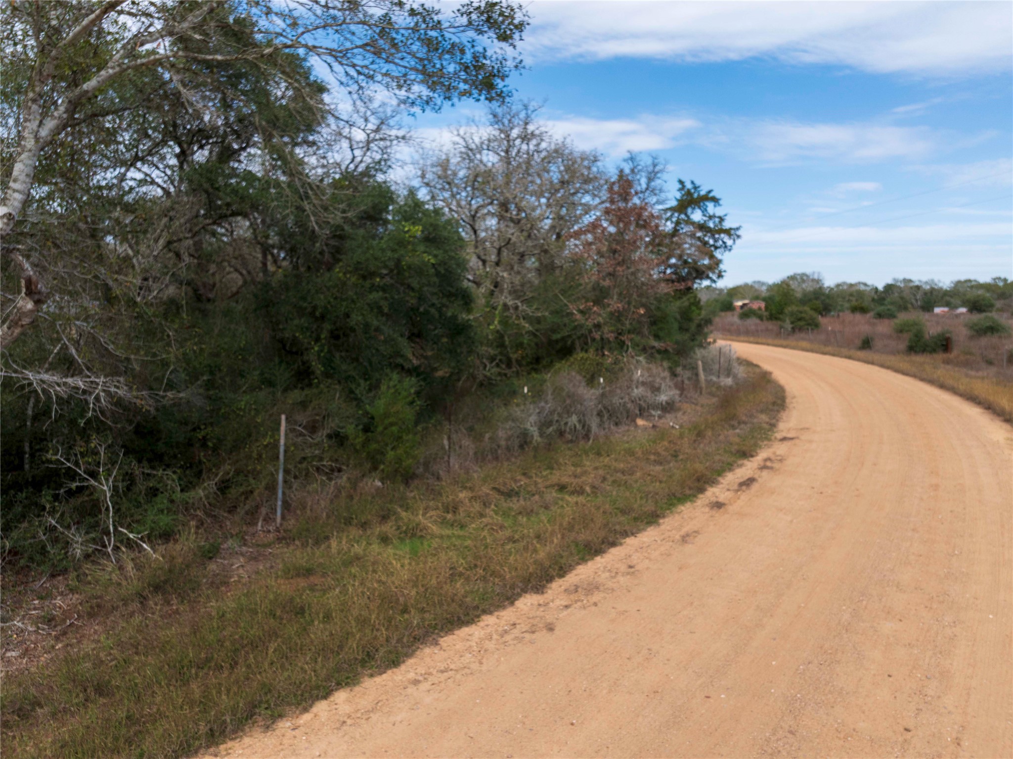 0 County Road 123 Sublime, TX 77986 - Photo 14 of 18 a view of a dry yard with wooden fence