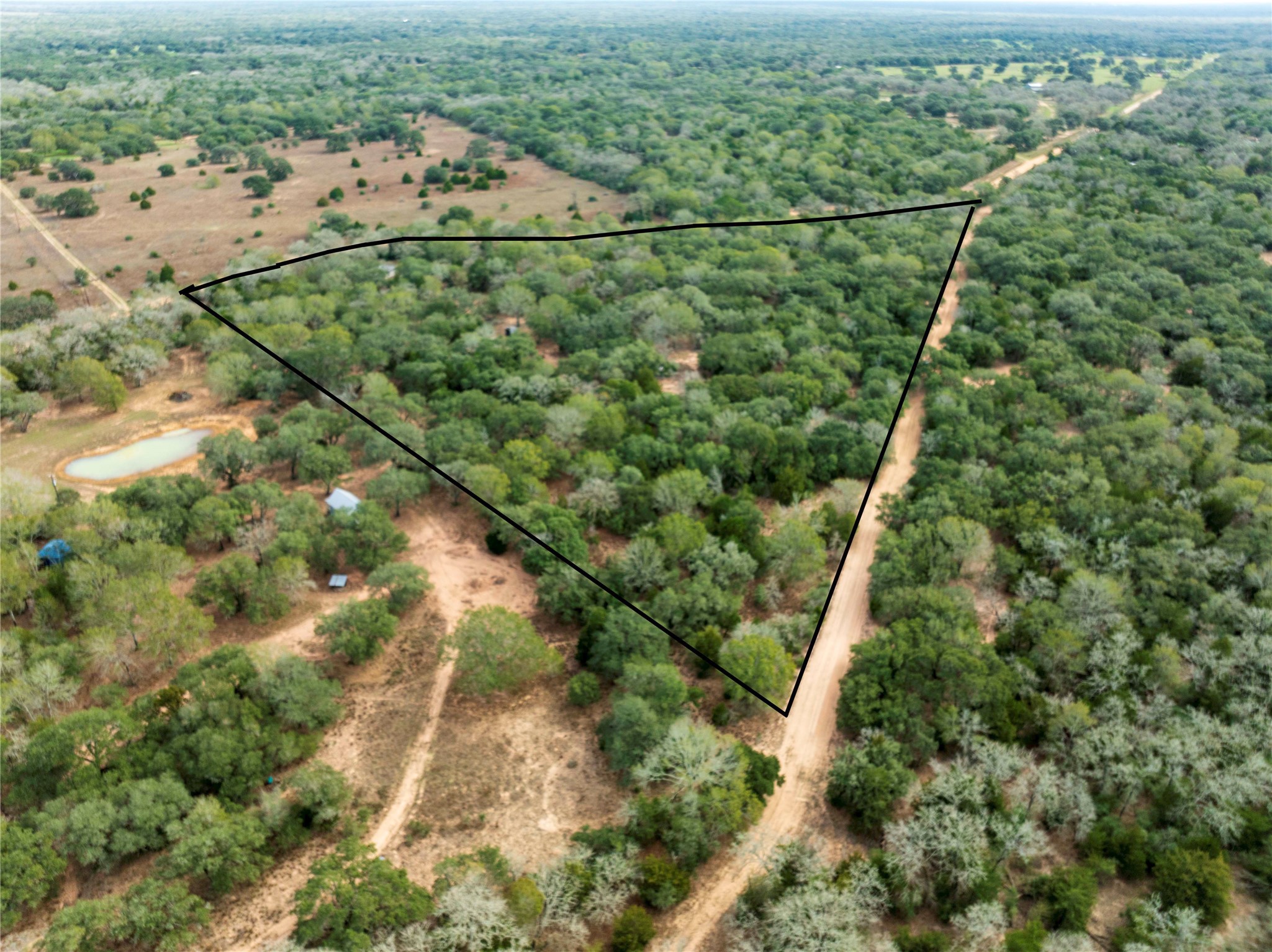 0 County Road 123 Sublime, TX 77986 - Photo 2 of 18 an aerial view of a house with a yard