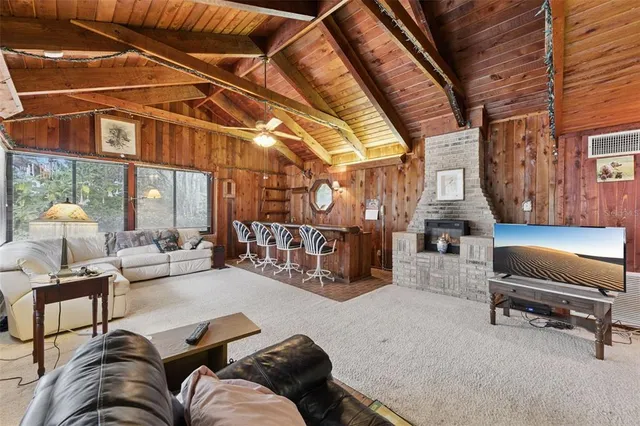 a kitchen with a refrigerator a stove cabinets and wooden floor