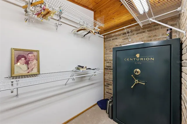 a living room with furniture and a ceiling fan
