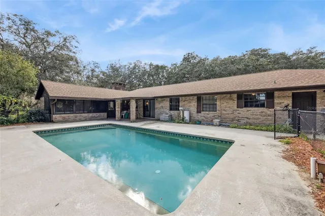 front view of a house with a swimming pool