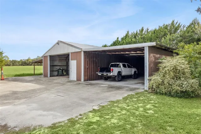 a view of a car garage with a car parked in it