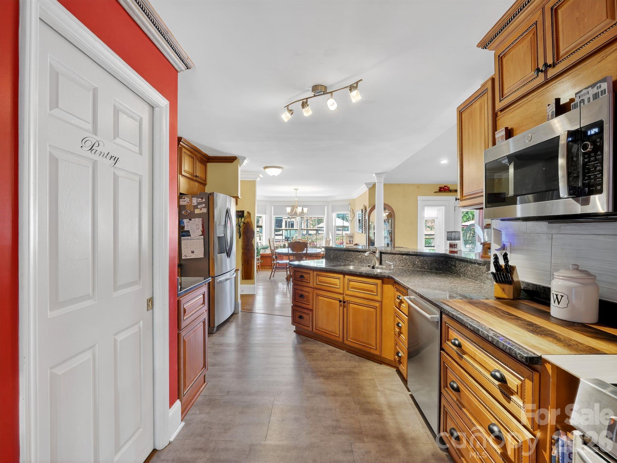 1035 McMillan Road Cheraw, SC 29520 - Photo 11 of 30 a large kitchen with stainless steel appliances lots of counter space and a sink
