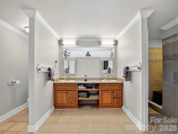 a kitchen with a stove top oven and cabinets
