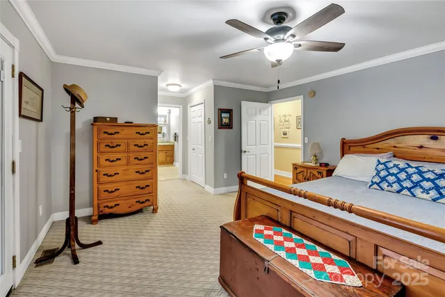 a bedroom with furniture and a baby crib