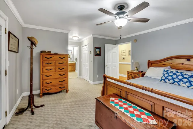 a bedroom with furniture and a baby crib