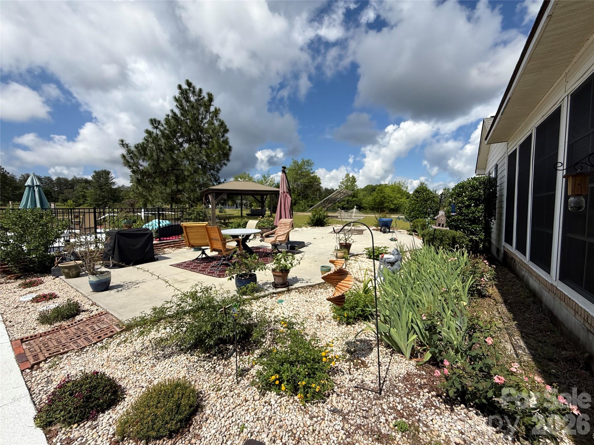 1035 McMillan Road Cheraw, SC 29520 - Photo 24 of 30 a view of a backyard with sitting area