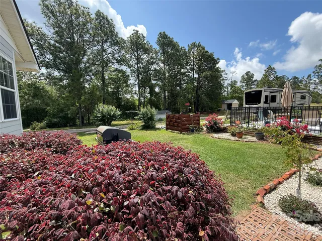 a view of a backyard with sitting area