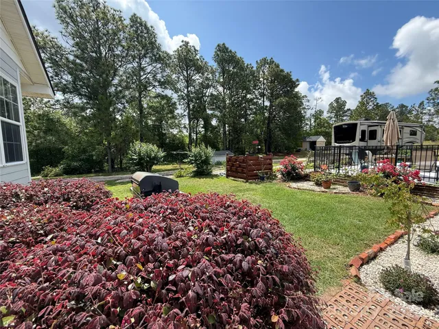a view of a backyard with sitting area