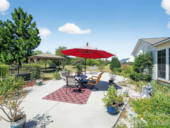 a patio with tables and chairs