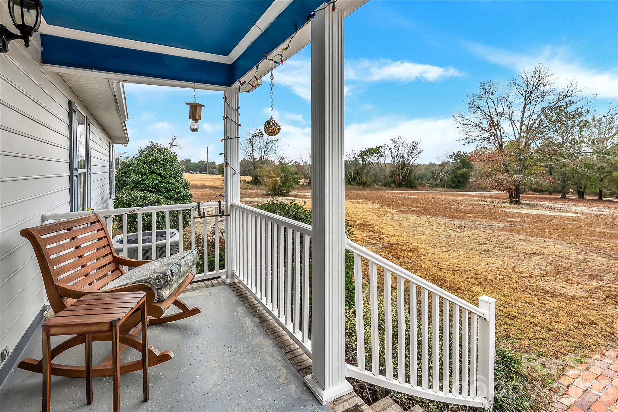 1035 McMillan Road Cheraw, SC 29520 - Photo 7 of 30 a view of a chair and tables in the balcony