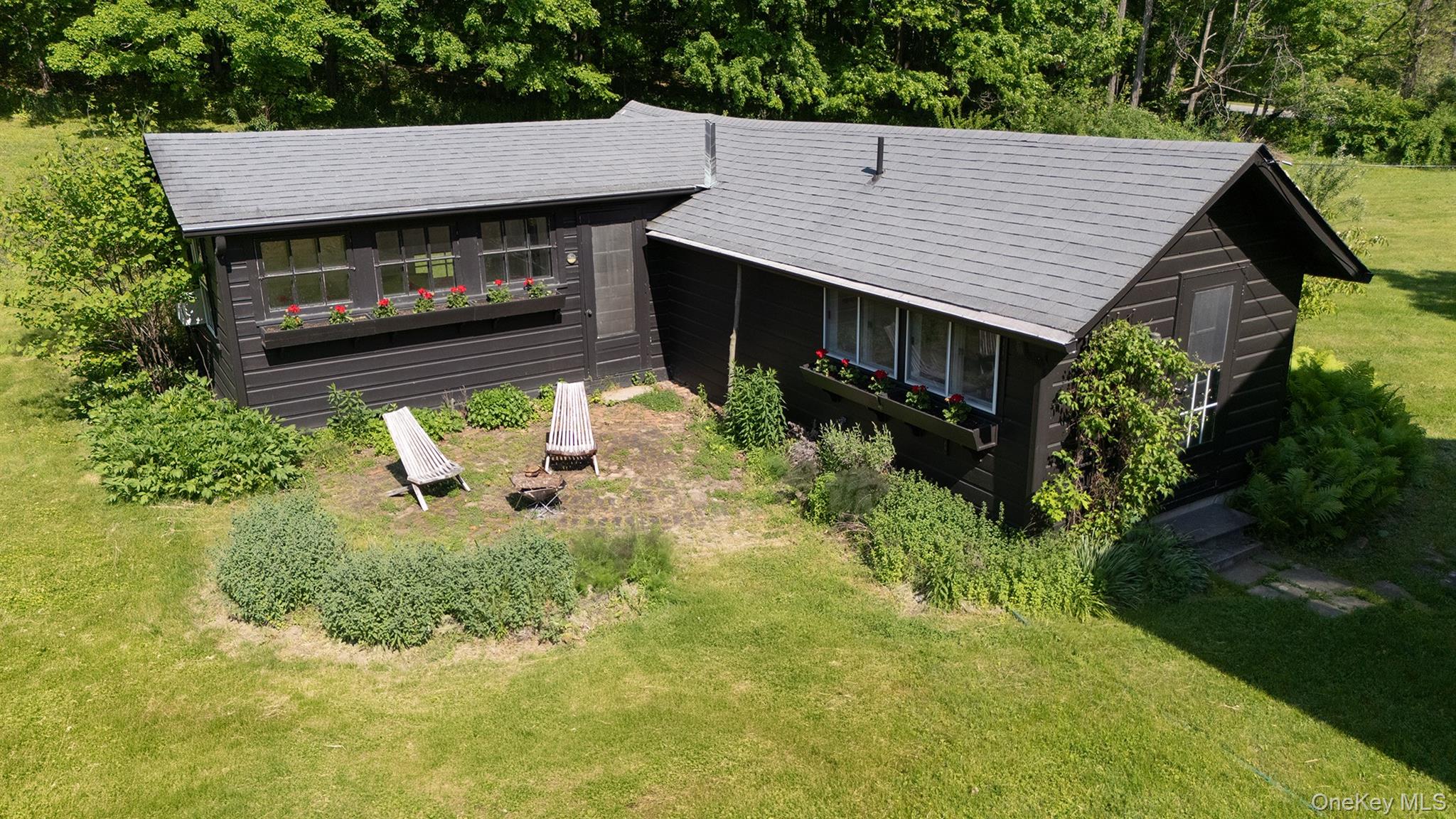 77 Upper Hook Road Rhinebeck, NY 12572 - Photo 28 of 48 an aerial view of a house with a yard table and chairs