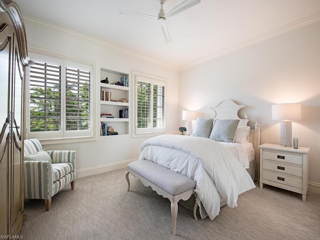 Xxx Lantern Lane Naples, FL 34102 - Photo 15 of 21 a bedroom with a bed and a large window