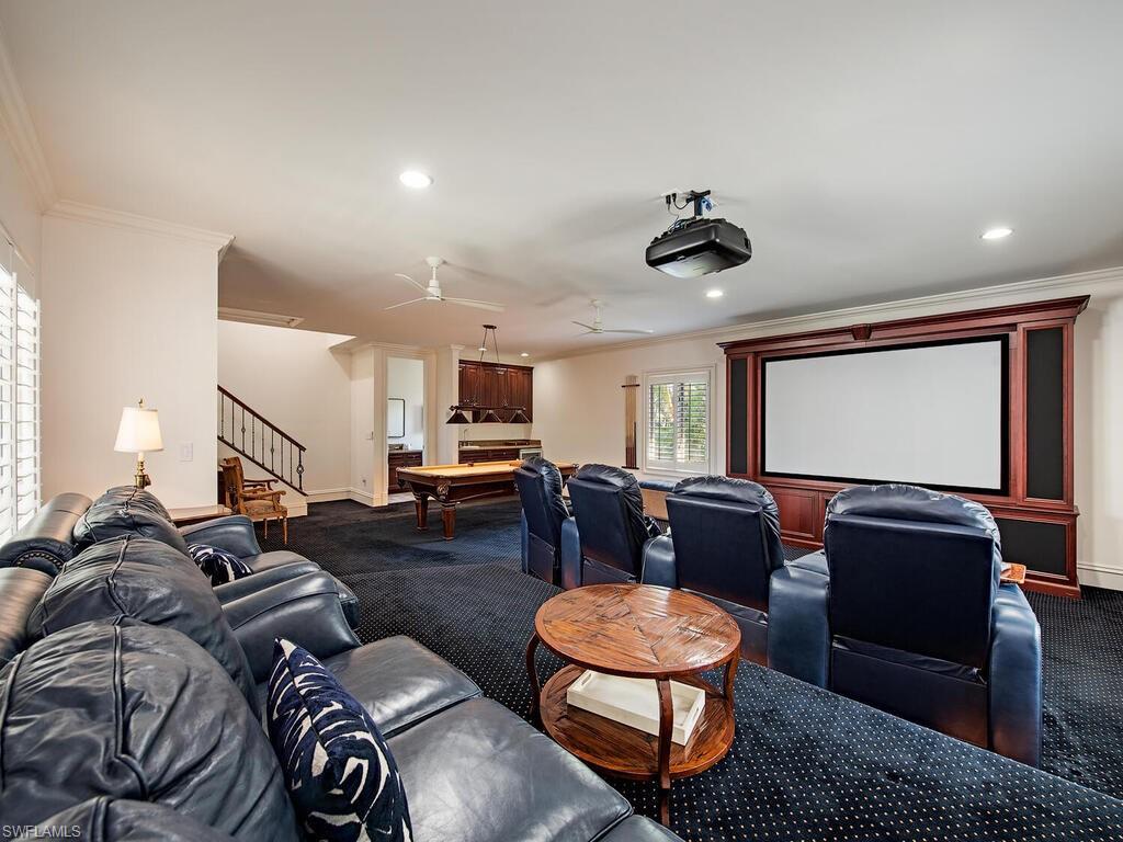 Xxx Lantern Lane Naples, FL 34102 - Photo 17 of 21 a living room with furniture ceiling fan and a window