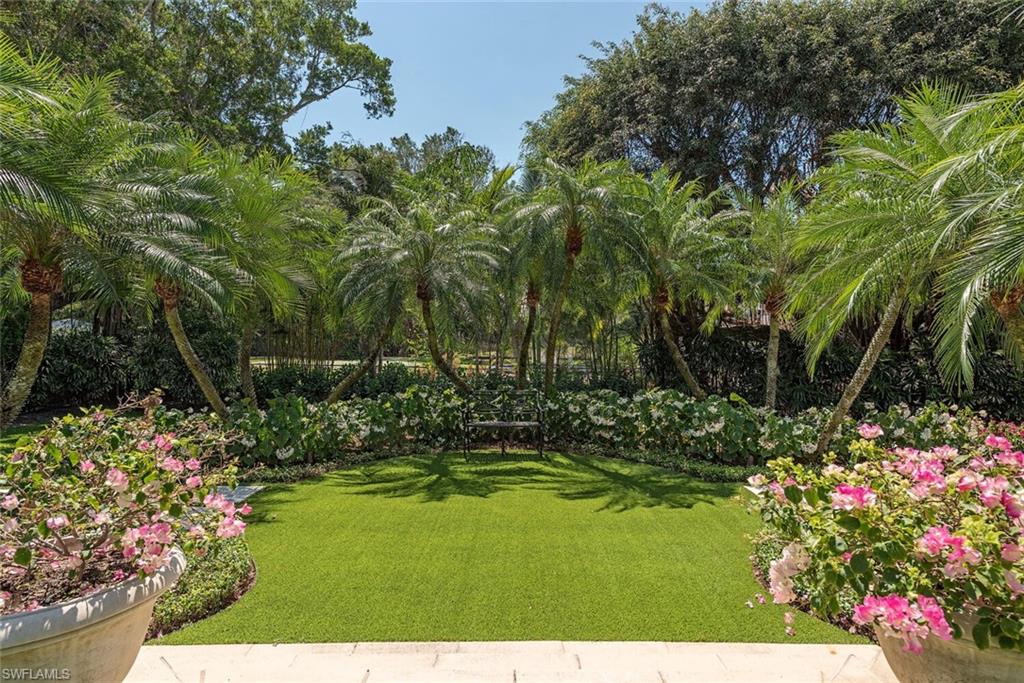 Xxx Lantern Lane Naples, FL 34102 - Photo 19 of 21 a view of a garden with flowers