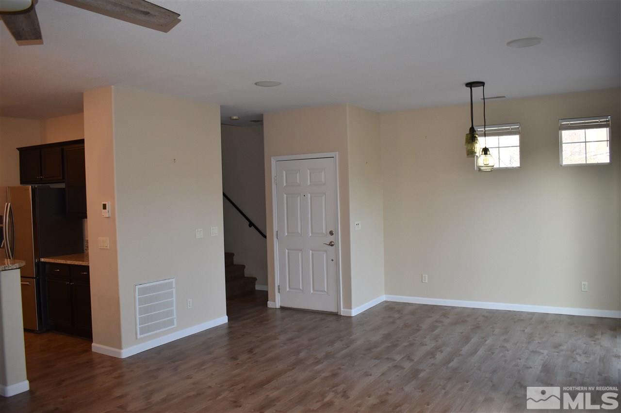 1845 Thousand Acres Way Reno, NV 89521 - Photo 8 of 20 a view of empty room with wooden floor and window