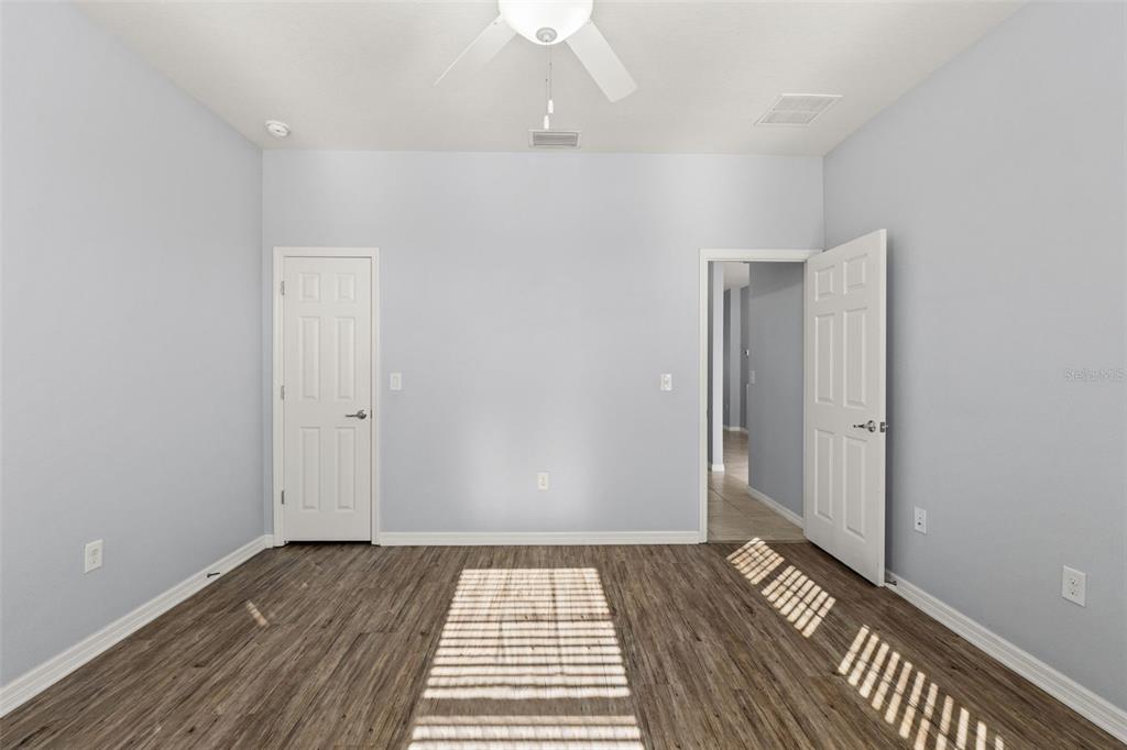 12653 Palapa Loop Spring Hill, FL 34610 - Photo 13 of 50 wooden floor in an empty room