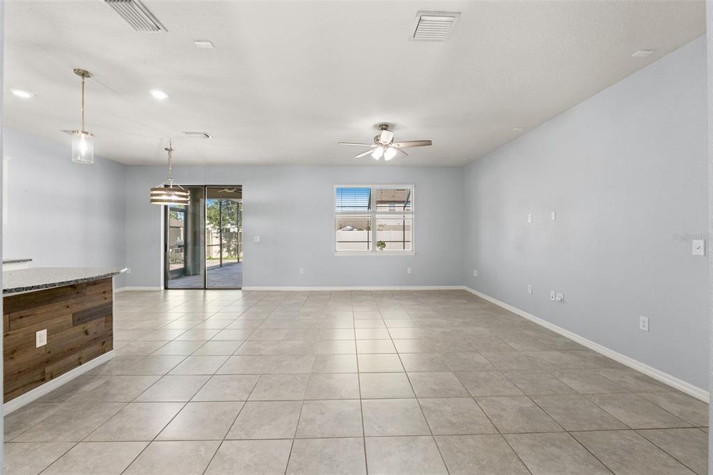 12653 Palapa Loop Spring Hill, FL 34610 - Photo 17 of 50 a view of an empty room with a window and fireplace