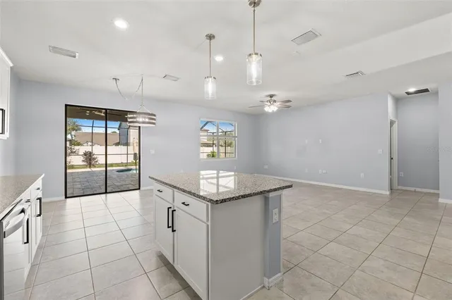 a bathroom with a granite countertop sink a large mirror and a shower