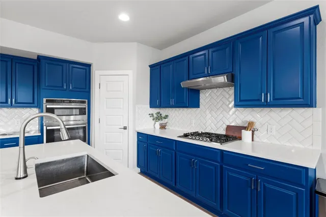 an aerial view of a house with a swimming pool