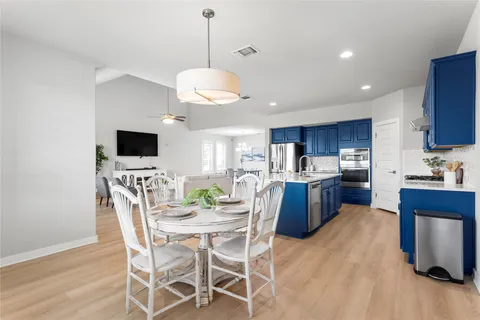 a kitchen with stainless steel appliances granite countertop a sink dishwasher stove and cabinets