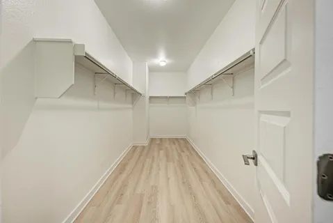 a bathroom with a sink double vanity and a mirror