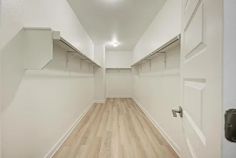 a bathroom with a sink double vanity and a mirror