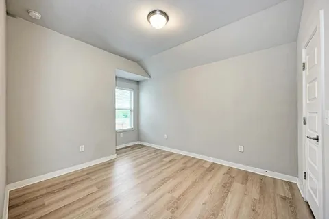 a bathroom with a double vanity sink and mirror