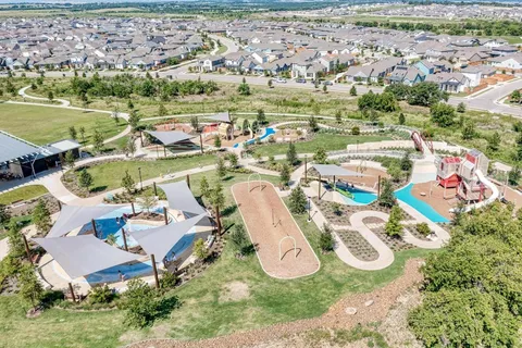 a view of a swimming pool with an outdoor seating