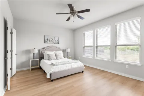 a kitchen with granite countertop wooden cabinets and stainless steel appliances