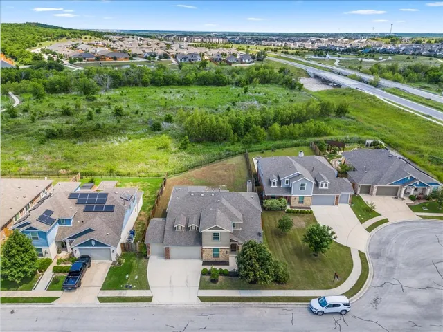 a spacious bedroom with a bed and a large window