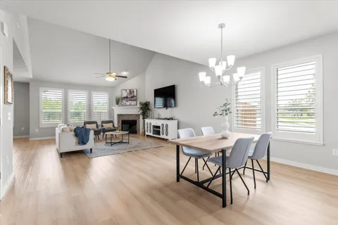 an aerial view of residential houses with outdoor space and river