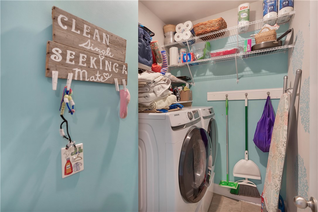 121 Ventura Street Anderson, SC 29621 - Photo 24 of 32 Functional laundry room includes dual appliances and convenient shelving.
