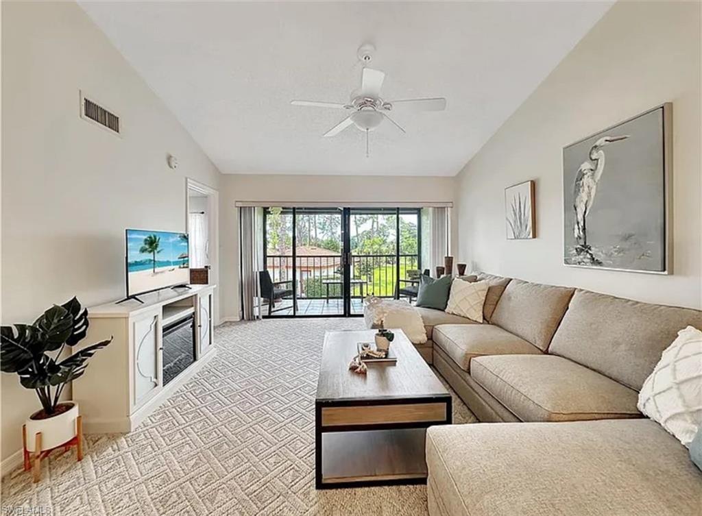 905 Augusta Boulevard Naples, FL 34113 - Photo 4 of 20 a living room with furniture and a flat screen tv