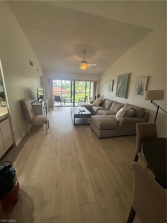 905 Augusta Boulevard Naples, FL 34113 - Photo 10 of 20 a living room with furniture and a large window